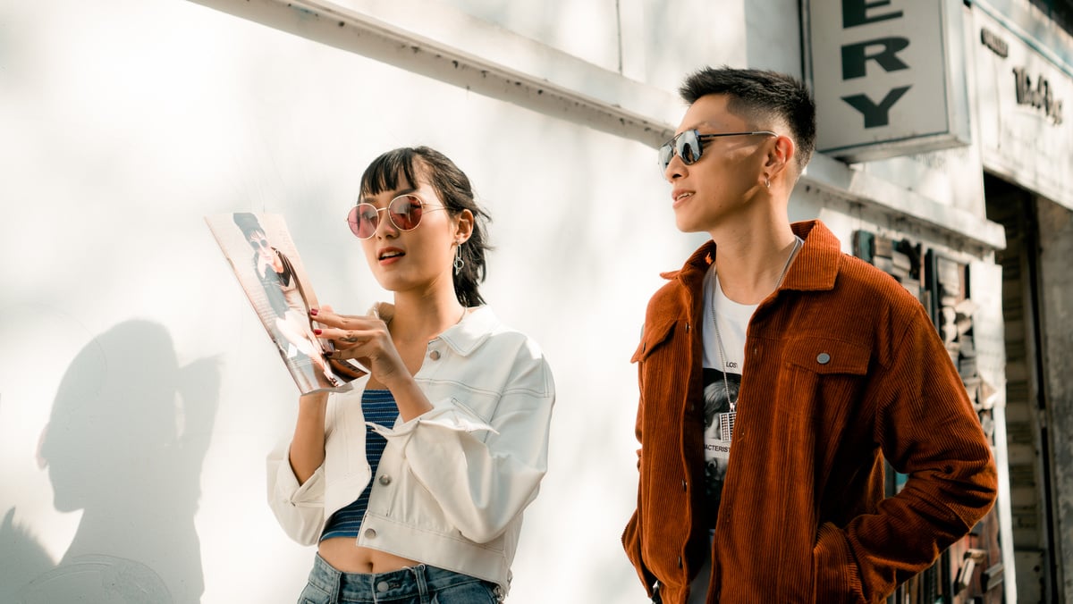 Photo of Man and Woman Standing Near Wall